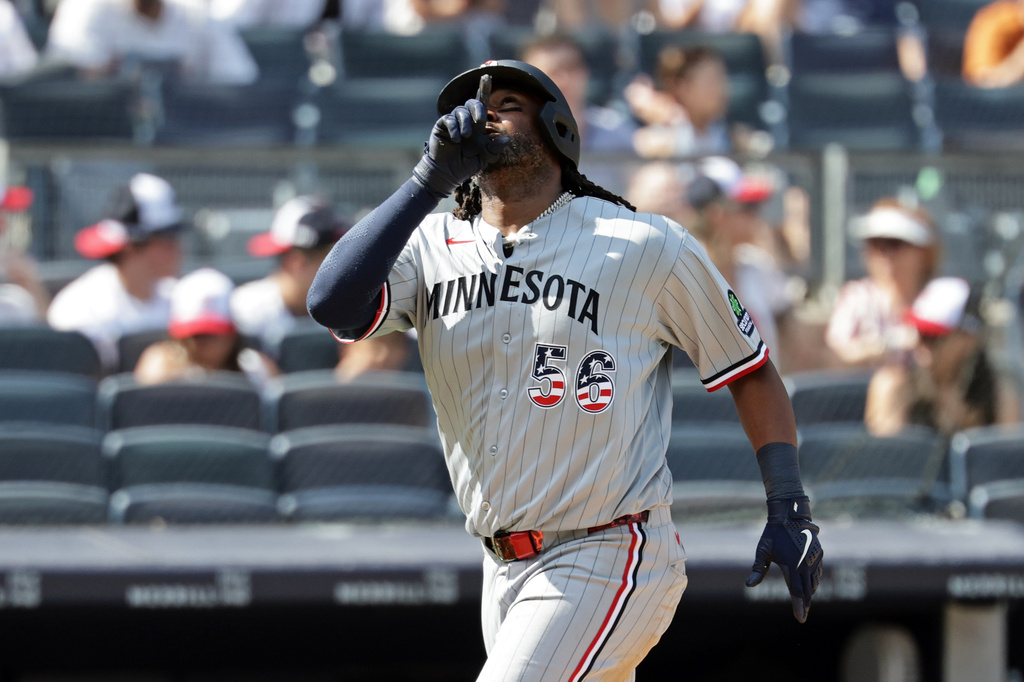 Minnesota Twins designated hitter Josh Bell reacts after hitting a solo home run during the seventh inning of a baseball game against the New York Yankees, Saturday, July 4, 2026, in New York. (AP Photo/Adam Hunger)