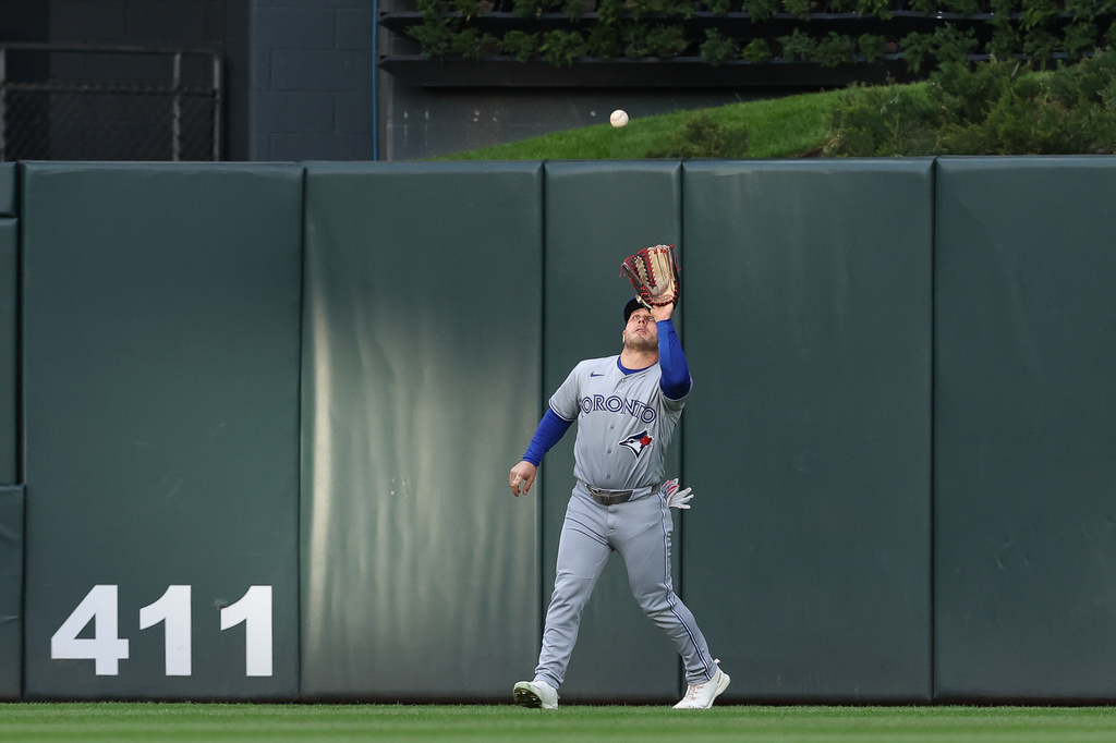 Toronto Blue Jays center fielder Daulton Varsho catches a fly ball hit by Minnesota Twins' Byron Buxton during the first inning of a baseball game Friday, May 1, 2026, in Minneapolis. (AP Photo/Stacy Bengs)