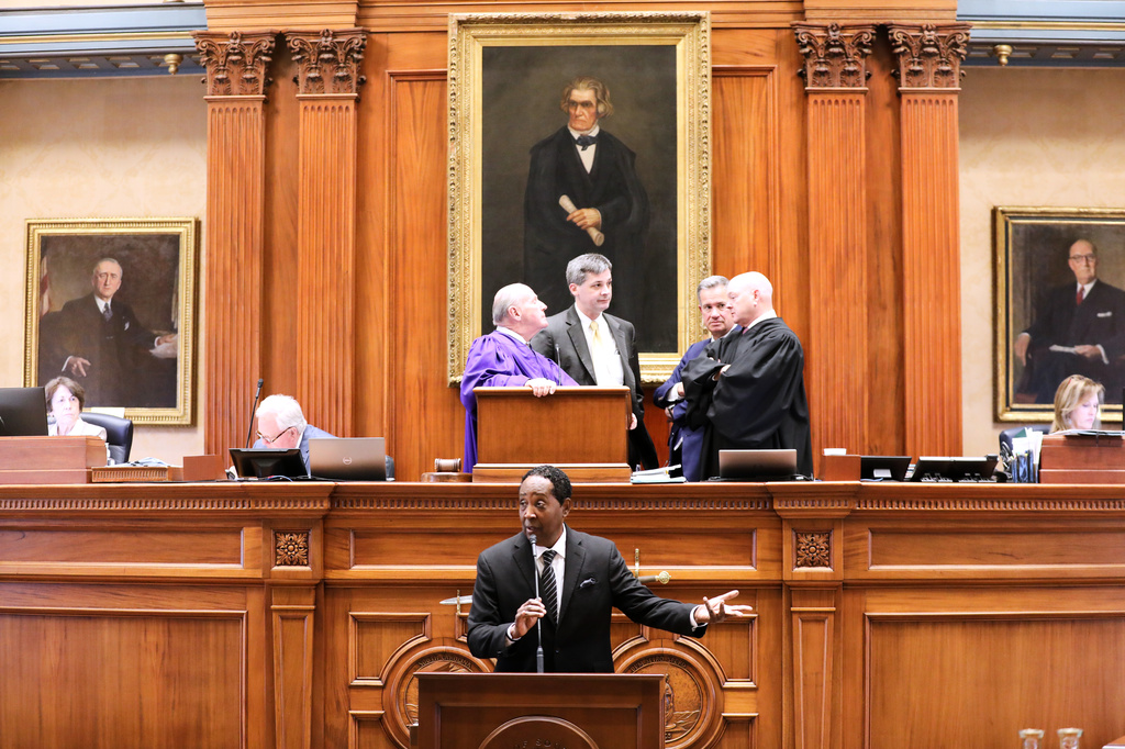 South Carolina Sen. Darrell Jackson, D-Columbia, speaks to the Senate in front of a portrait of former U.S. Vice President and slavery supporter John C. Calhoun on Tuesday, April 14, 2026, in Columbia, S.C. (AP Photo/Jeffrey Collins)