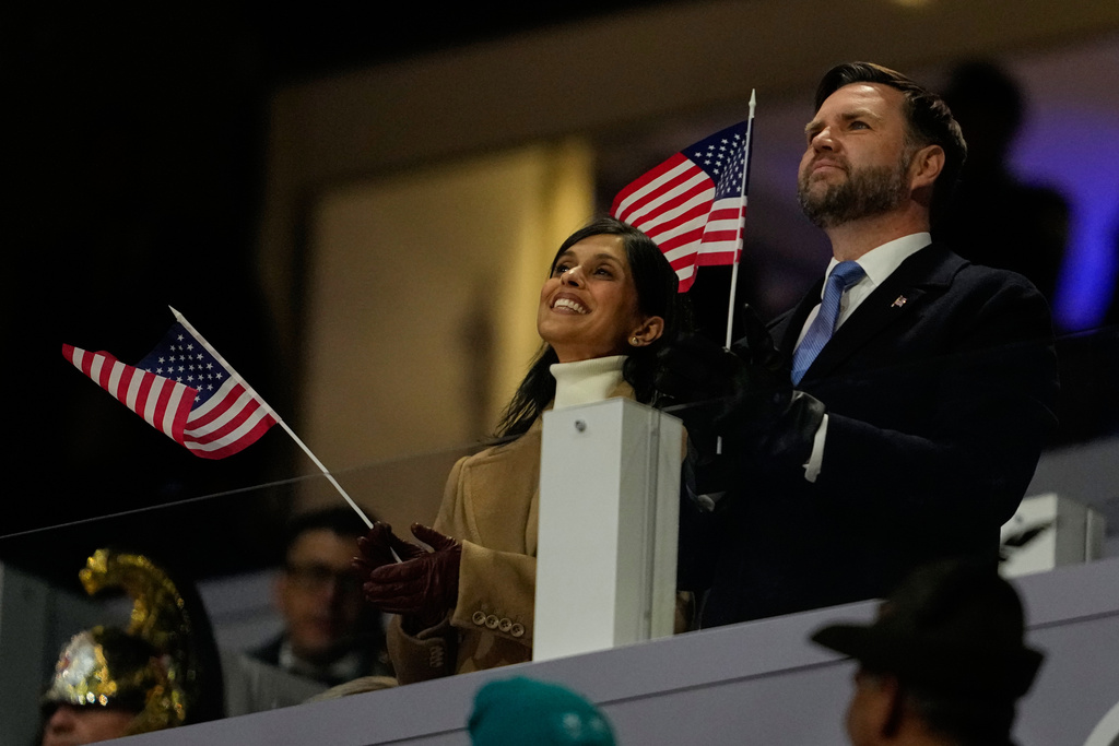 Vice President JD Vance and his wife Usha Vance cheer on team USA during the Olympic opening ceremony at the 2026 Winter Olympics, in Milan, Italy, Friday, Feb. 6, 2026. (AP Photo/Ashley Landis)