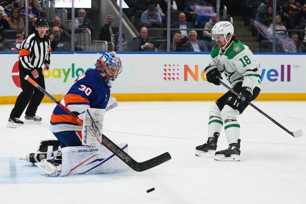 New York Islanders goaltender Ilya Sorokin (30) stops a shot by Dallas Stars' Sam Steel (18) during the first period of an NHL hockey game Thursday, March 26, 2026, in Elmont, N.Y. (AP Photo/Frank Franklin II)