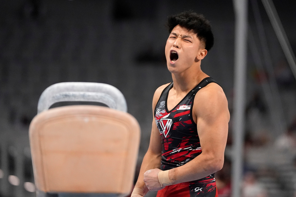 FILE -Yul Moldauer celebrates after competing on the pommel horse during the U.S. gymnastics championships June 1, 2024, in Fort Worth, Texas. (AP Photo/Tony Gutierrez, File)