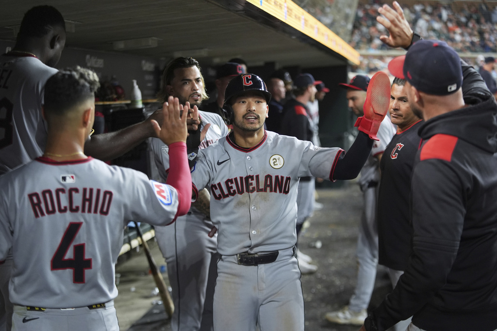 Cleveland Guardians' Steven Kwan celebrates scoring against the Detroit Tigersduring the10th inning of a baseball game Tuesday, Sept. 16, 2025, in Detroit. (AP Photo/Paul Sancya)