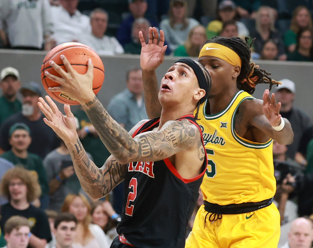 Utah guard Terrence Brown pulls up while shooting over Baylor guard Obi Agbim in the first half of an NCAA college basketball game, Saturday, March 7, 2026, in Waco, Texas. (Rod Aydelotte/Waco Tribune-Herald via AP)