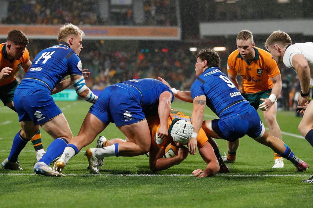 Australia's Josh Canham , center, score the first try against Italy during their Nations Championship rugby international test match in Perth, Australia, Saturday, July 18, 2026. (AP Photo/Gary Day)