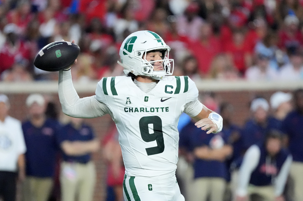 Charlotte quarterback Cole Gonzales (9) passes against Mississippi during the first half of an NCAA college football game in Oxford, Miss., Saturday, Sept. 12, 2026. (AP Photo/Rogelio V. Solis)