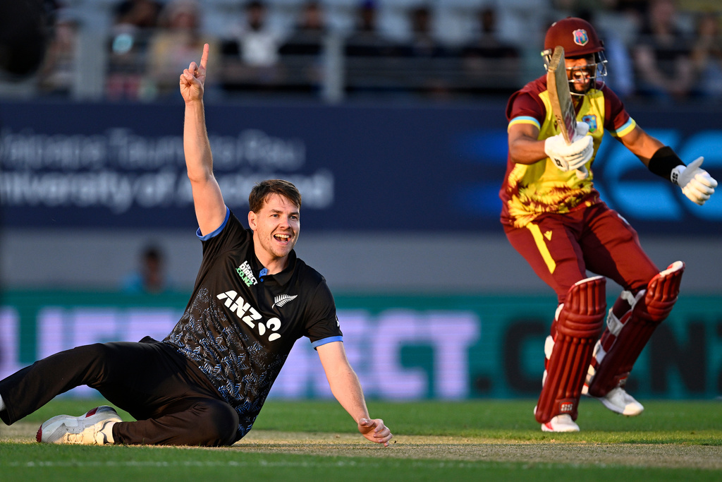 New Zealand bowler Jacob Duffy appeals for a run out as West Indies player Shai Hope reacts during the T20 cricket international between New Zealand and the West Indies in Auckland, New Zealand, Wednesday, Nov. 5, 2025. (Andrew Carnaga/Photosport via AP)
