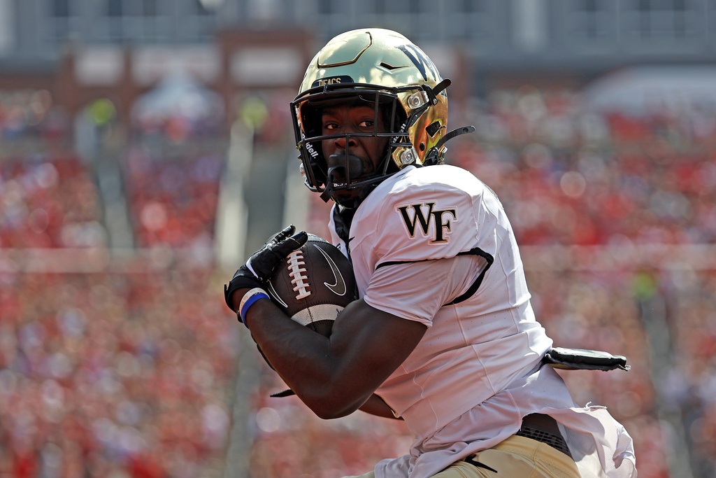 FILE - Wake Forest running back Demond Claiborne (1) hauls in a pass for a touchdown against North Carolina State during the first half of an NCAA college football game in Raleigh, N.C., Saturday, Oct. 5, 2024. (AP Photo/Karl B DeBlaker, File)
