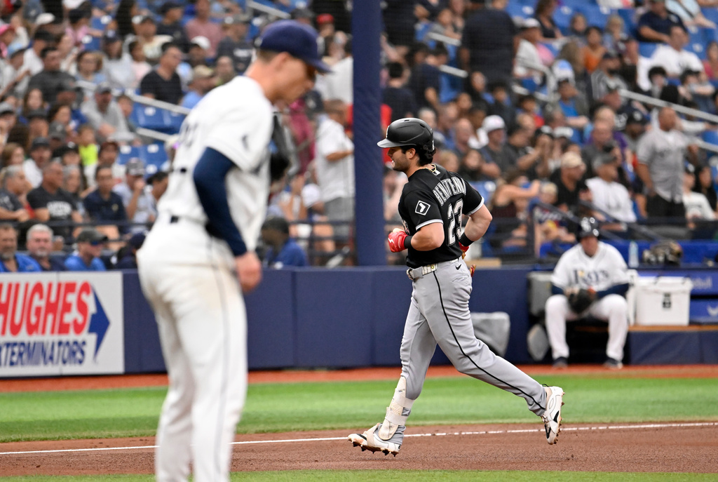 Chicago White Sox's Andrew Benintendi (23) rounds the bases after hitting a home run off Tampa Bay Rays pitcher Griffin Jax, left, during the fourth inning of a baseball game Sunday, Aug. 2, 2026, in St. Petersburg, Fla. (AP Photo/Jason Behnken)