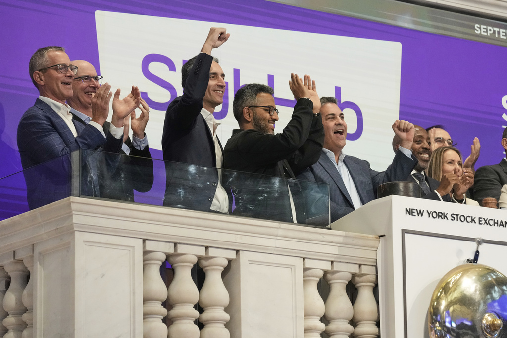 StubHub President Nayaab Islam, third from right, and CEO Eric Baker, second from right, celebrate as they ring the New York Stock Exchange opening bell before the company's IPO, Wednesday, Sept. 17, 2025. (AP Photo/Richard Drew)