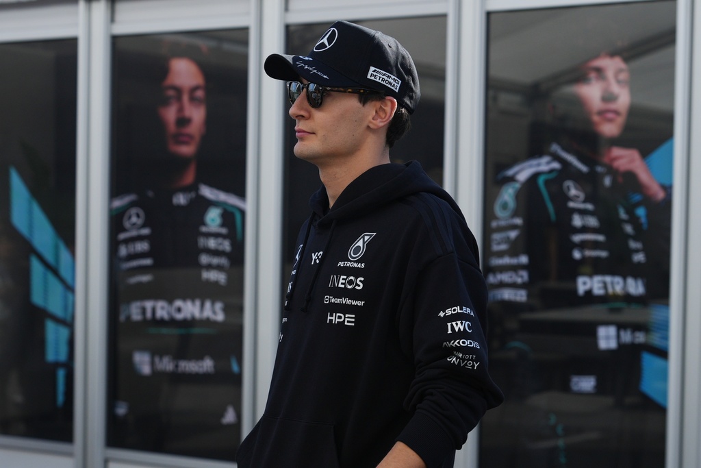 Mercedes driver George Russell of Britain walks towards the Mercedes garage in Suzuka, central Japan, Thursday, March 26, 2026, ahead of Sunday's Japanese Formula One Grand Prix race. (AP Photo/Hiro Komae)