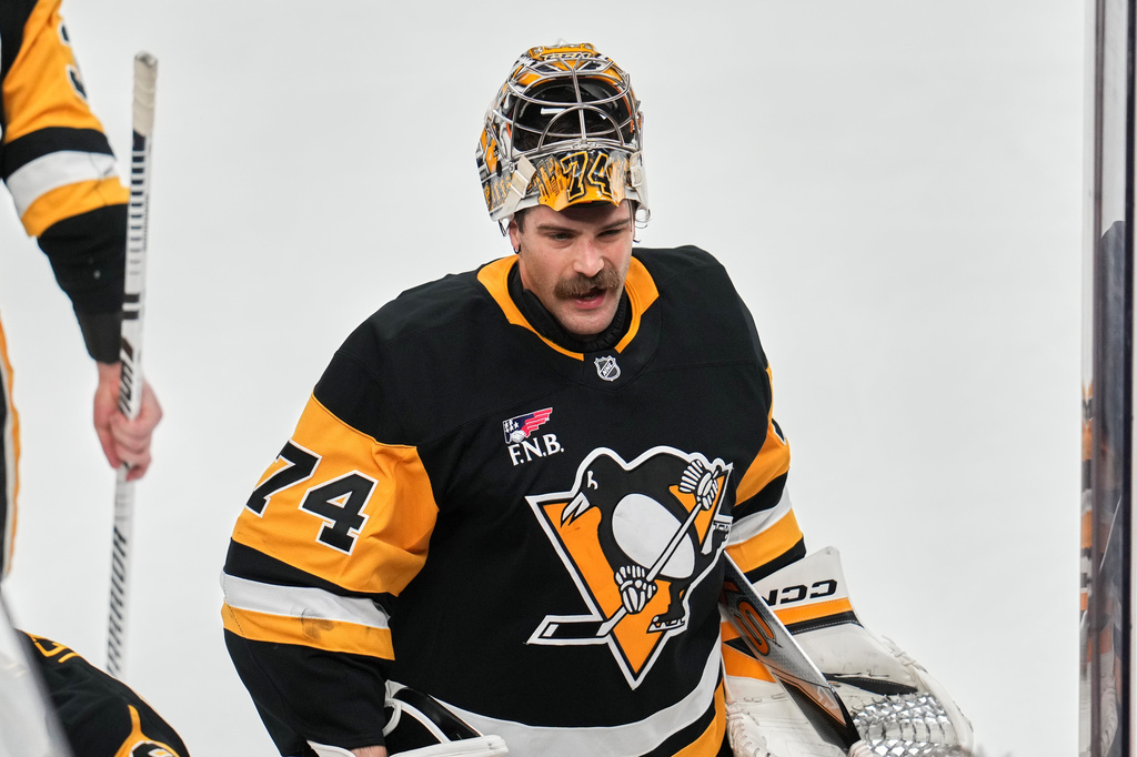 FILE - Pittsburgh Penguins goaltender Stuart Skinner takes a timeout during the first period of an NHL hockey game against the Dallas Stars in Pittsburgh, March 28, 2026. (AP Photo/Gene J. Puskar, File)