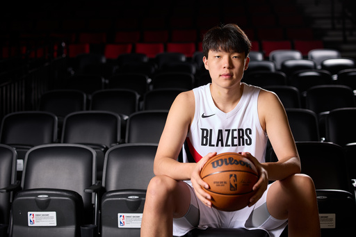 Portland Trail Blazers center Yang Hansen poses for photos during the NBA basketball team's media day in Portland, Ore., Monday, Sept. 29, 2025. (AP Photo/Craig Mitchelldyer) Portland Trail Blazers center Yang Hansen poses for photos during the NBA basketball team's media day in Portland, Ore., Monday, Sept. 29, 2025. (AP Photo/Craig Mitchelldyer)