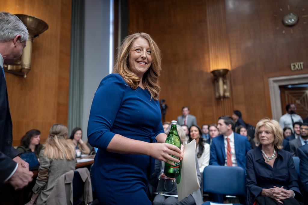 Wellness influencer and entrepreneur Dr. Casey Means takes her seat before the Senate health committee as she seeks approval to be U.S. surgeon general, at the Capitol in Washington, Wednesday, Feb. 25, 2026. (AP Photo/J. Scott Applewhite)