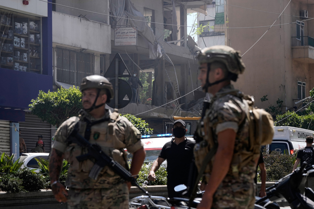 Lebanese soldiers stand guard at the site of an Israeli airstrike that struck an apartment in Dahiyeh, Beirut's southern suburbs, Lebanon, Sunday, June 14, 2026. (AP Photo/Bilal Hussein)