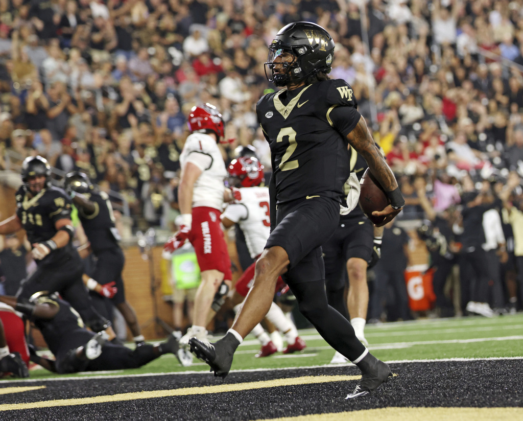 Wake Forest quarterback Robby Ashford scores on a quarterback keeper against North Carolina State during an NCAA college football game Thursday, Sept. 11, 2025, in Winston-Salem, N.C. (Walt Unks/The Winston-Salem Journal via AP)