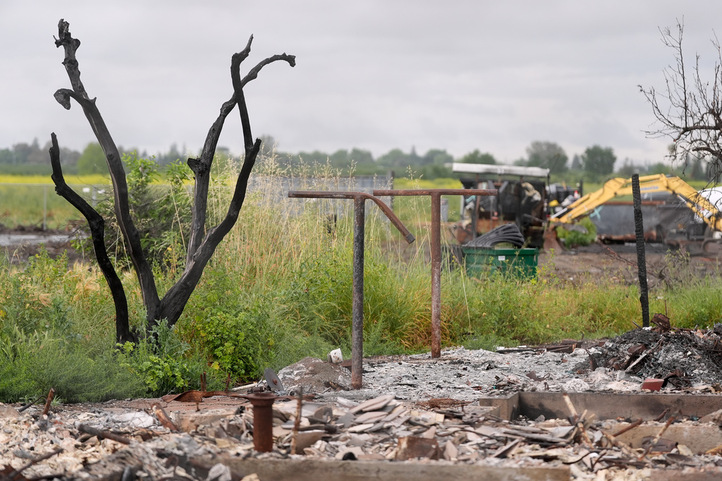 Property damage is shown at the location of a July 1, 2025, fireworks explosion in Esparto, Calif., Friday, April 10, 2026. (AP Photo/Jeff Chiu)