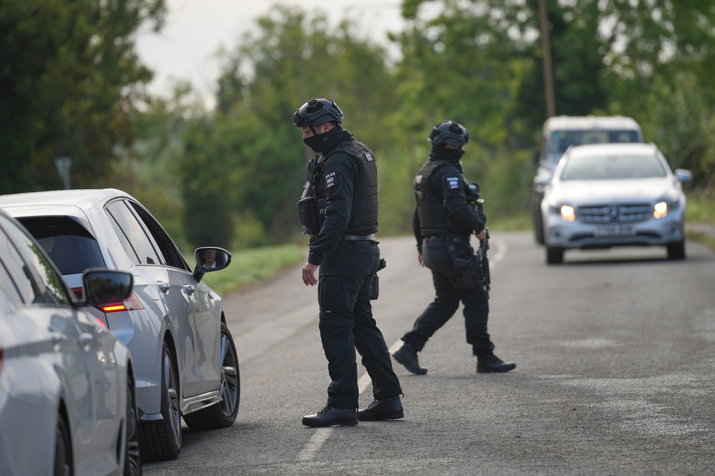 Police guard a road leading to RAF Fairford, in Fairford, England, Monday, Sept. 28, 2026. (AP Photo/Alastair Grant)