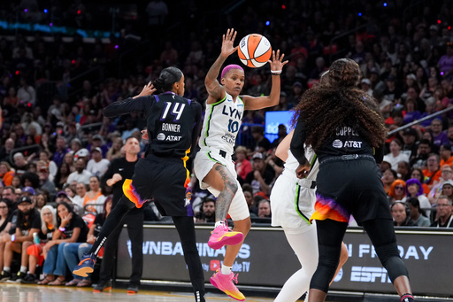 Minnesota Lynx guard Courtney Williams (10) loses control of the ball while guarded by Phoenix Mercury forward DeWanna Bonner (14) during the first half of Game 4 of a WNBA basketball playoff semifinals series, Sunday, Sept. 28, 2025, in Phoenix. (AP Photo/Samantha Chow) Minnesota Lynx guard Courtney Williams (10) loses control of the ball while guarded by Phoenix Mercury forward DeWanna Bonner (14) during the first half of Game 4 of a WNBA basketball playoff semifinals series, Sunday, Sept. 28, 2025, in Phoenix. (AP Photo/Samantha Chow)