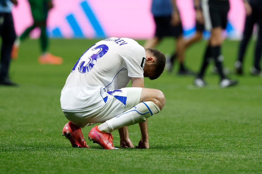 Uzbekistan's Sherzod Nasrullaev (13) reacts to a loss during the World Cup Group K soccer match between DR Congo and Uzbekistan in Atlanta, Saturday, June 27, 2026. (AP Photo/Erik S. Lesser)