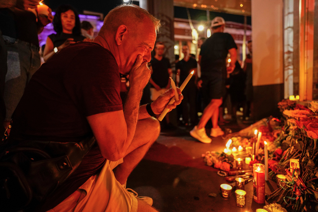 Denis Ramsey cries during a vigil for the victims of an overnight crash of a vehicle involved in a high speed chase, which caused several deaths and multiple injuries at Bradley's on 7th, a popular LGBTQ+ nightclub, Saturday, Nov. 8, 2025, in Tampa, Fla. (Martha Asencio-Rhine/Tampa Bay Times via AP)