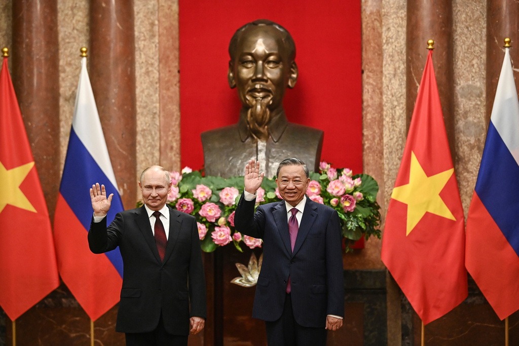FILE - Russian President Vladimir Putin, left, and Vietnam's President To Lam pose for photos at the Presidential Palace in Hanoi, Vietnam on June 20, 2024. (Nhac Nguyen/Pool Photo via AP, File)