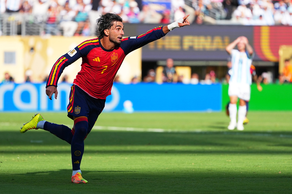 Spain's Ferran Torres (7) celebrates scoring their first goal during the World Cup final soccer match between Spain and Argentina in East Rutherford, N.J., near New York, Sunday, July 19, 2026. (AP Photo/Julio Cortez)