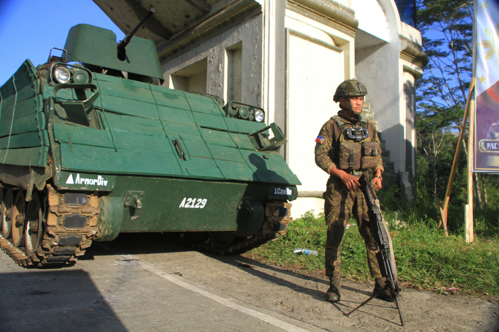 An armored personnel carrier stays at a checkpoint during the Bangsamoro Autonomous Region in Muslim Mindanao parliamentary elections at a school in Saguiaran, Lanao del Sur province, southern Philippines, Monday, Sept. 14, 2026. (AP Photo/Richel V.Umel)