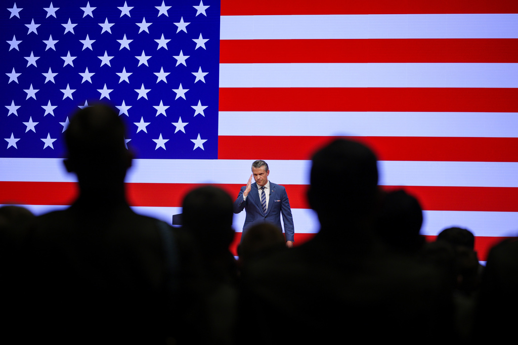 Secretary of Defense Pete Hegseth salutes troops after giving a State of the Force address at Marine Corps Base Quantico, Wednesday, Sept. 30, 2026 in Quantico, Va. (Alex Wong/Pool Photo via AP)
