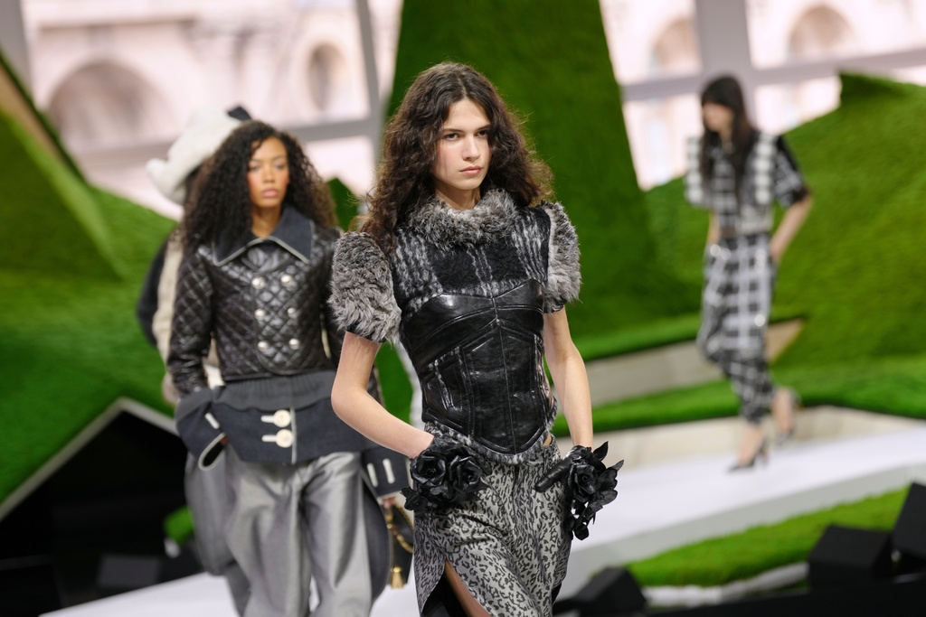 Models wear creations from the Louis Vuitton Fall/Winter 2026-2027 Women's collection presented in Paris, Tuesday, March 10, 2026. (AP Photo/Aurelien Morissard)
