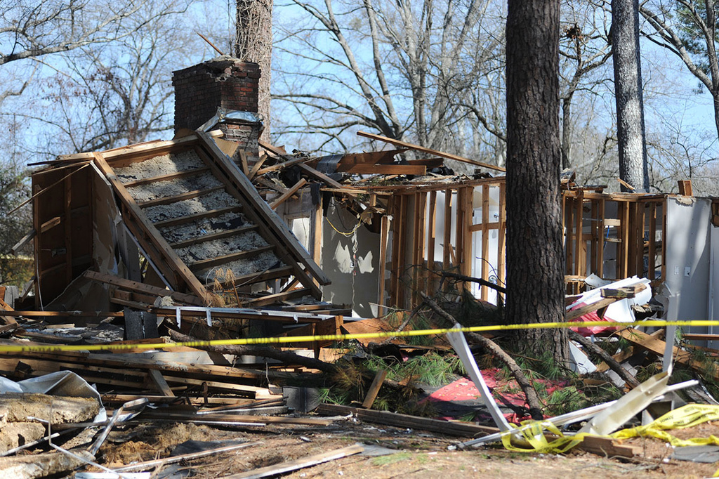 Yellow tape blocks a damaged house in Jackson, Miss., Wednesday, Feb. 21, 2024, after it was damaged by a natural gas explosion Wednesday, Jan. 24, 2024. (Vickie D. King/Mississippi Today via AP)