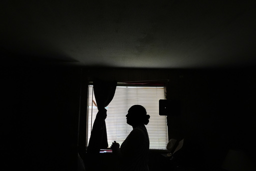 Paola Freites, who asked to be identified by her middle name and second last name to protect her family's safety, stands inside the two-bedroom mobile home where she lives with her husband and three children after fleeing persecution in their native Colombia, Thursday, Aug. 21, 2025, in Apopka, Fla. (AP Photo/Rebecca Blackwell) Paola Freites, who asked to be identified by her middle name and second last name to protect her family's safety, stands inside the two-bedroom mobile home where she lives with her husband and three children after fleeing persecution in their native Colombia, Thursday, Aug. 21, 2025, in Apopka, Fla. (AP Photo/Rebecca Blackwell)