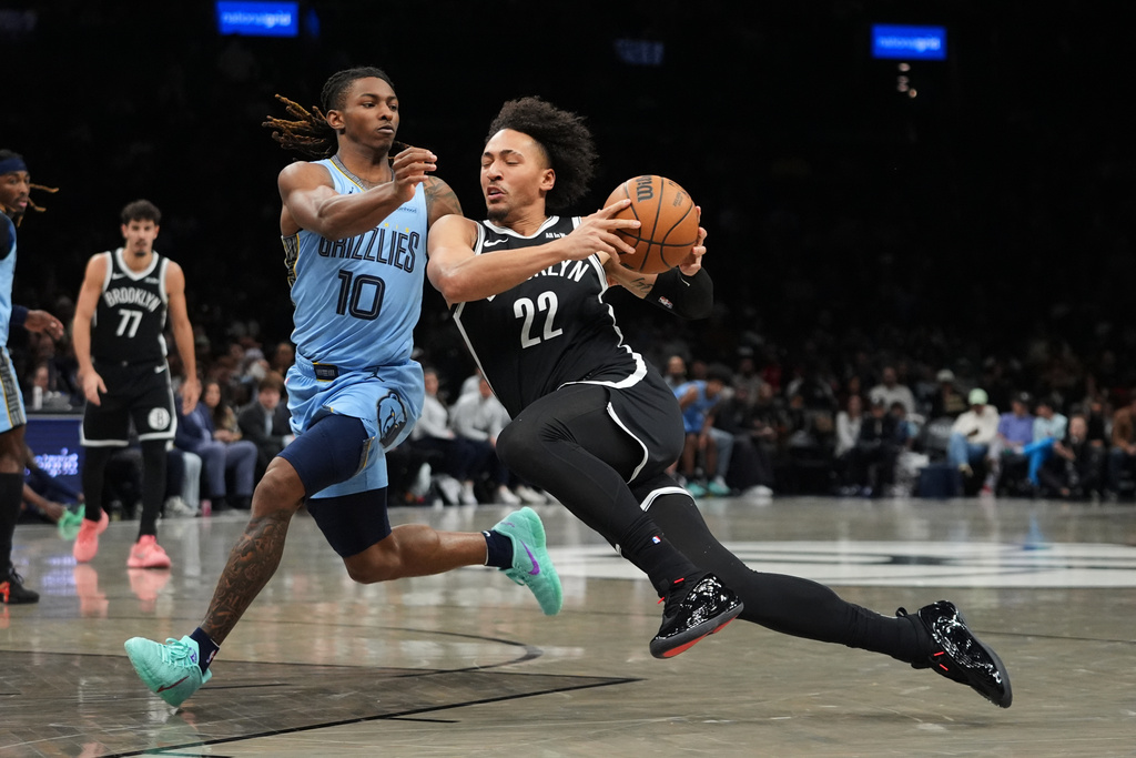 Memphis Grizzlies' Javon Small (10) defends Brooklyn Nets' Jalen Wilson (22) during the first half of an NBA basketball game Monday, March 9, 2026, in New York. (AP Photo/Frank Franklin II)