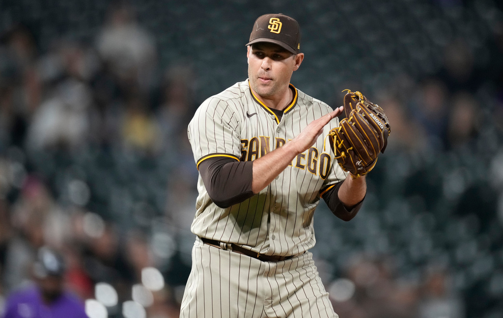 FILE - San Diego Padres relief pitcher Craig Stammen reacts after getting Colorado Rockies' Brian Serven to ground out to end the ninth inning of a baseball game Saturday, Sept. 24, 2022, in Denver. (AP Photo/David Zalubowski, File)