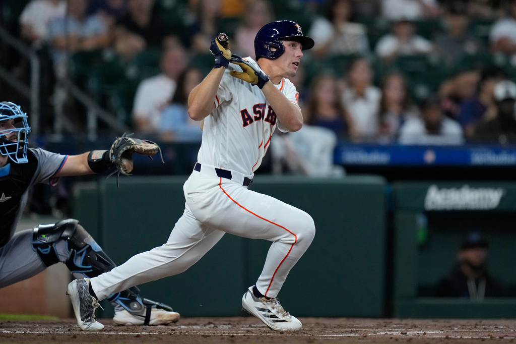 Houston Astros' Lucas Spence hits an RBI double during the second inning of a baseball game against the Miami Marlins, Tuesday, July 21, 2026, in Houston. (AP Photo/Kevin M. Cox)