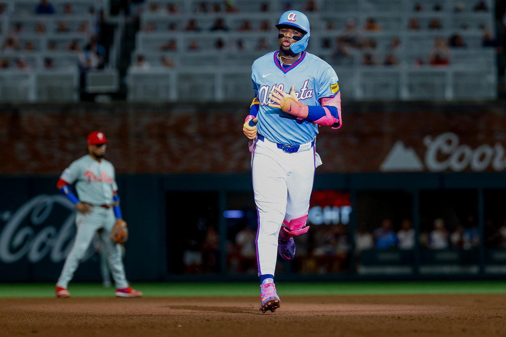 Atlanta Braves' Ronald Acuña Jr. rounds the bases after hitting a solo home run against the Philadelphia Phillies during the fourth inning of a baseball game, Saturday, Sept. 12, 2026, in Atlanta. (AP Photo/Erik S. Lesser)