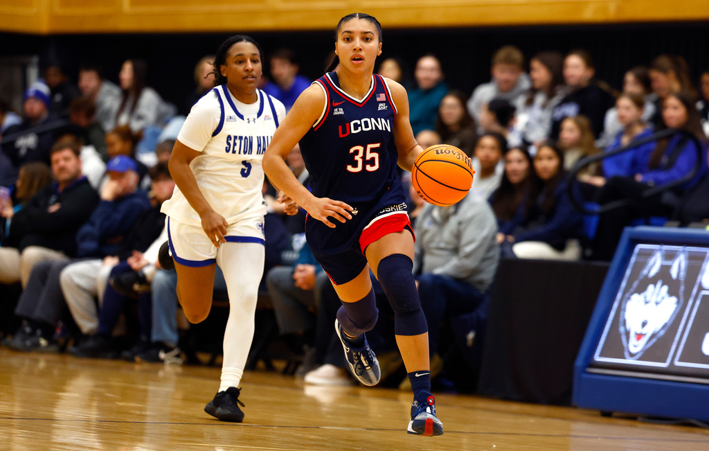 UConn guard Azzi Fudd (35) drives to the basket against Seton Hall guard Savannah Catalon (5) during the first half of an NCAA college basketball game, Saturday, Jan. 24, 2026, in South Orange, N.J. (AP Photo/Noah K. Murray)