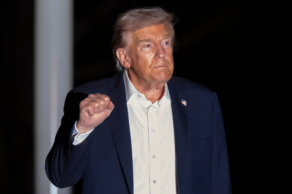 President Donald Trump walks across the South Lawn of the White House, early Tuesday, Oct. 14, 2025, in Washington, after returning from a trip to Israel and Egypt. (AP Photo/Mark Schiefelbein)