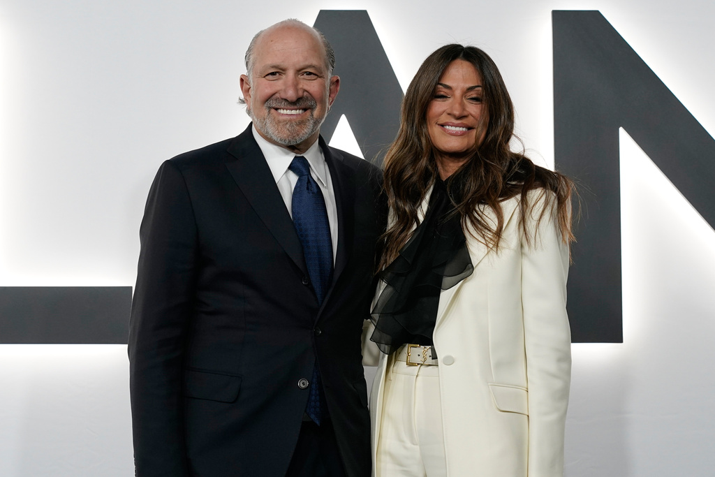 Commerce Secretary Howard Lutnick and his wife Allison arrive for the premiere of first lady Melania Trump's movie "Melania" at The John F. Kennedy Memorial Center For The Performing Arts, Thursday, Jan. 29, 2026, in Washington. (AP Photo/Jose Luis Magana)