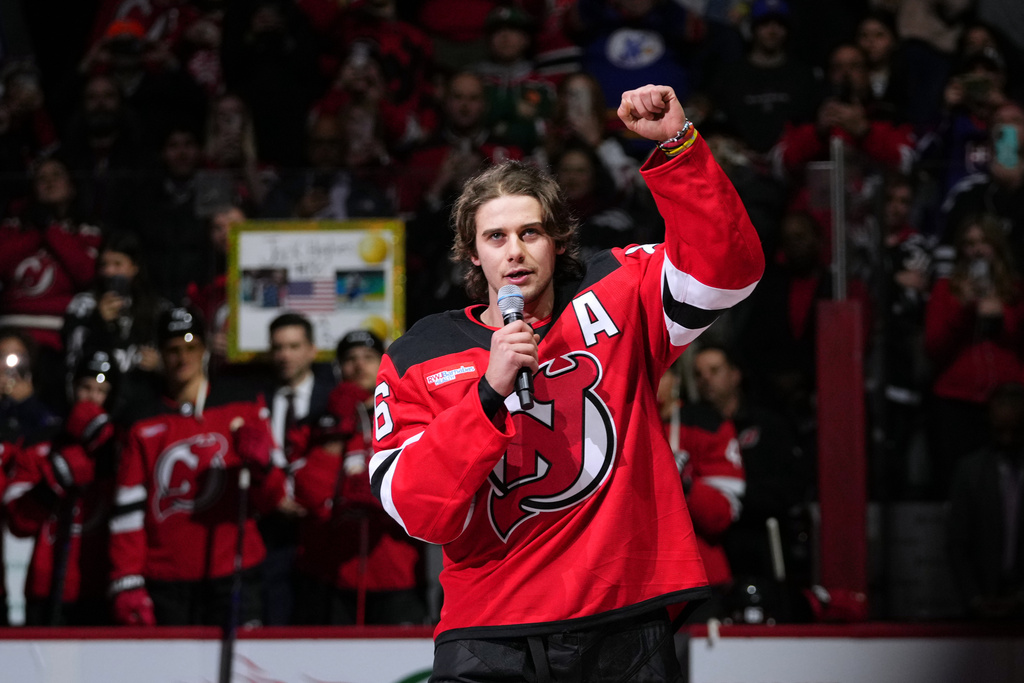 New Jersey Devils' Jack Hughes (86) speaks to fans before an NHL hockey game against the Buffalo Sabres Wednesday, Feb. 25, 2026, in Newark, N.J. (AP Photo/Frank Franklin II)