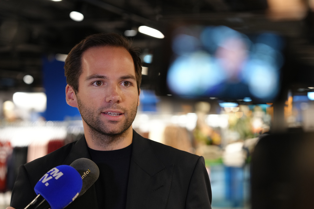 BHV (Bazar de l'Hotel de Ville) general store director Karl-Stephane Cottendin answers reporters ahead of the Chinese company Shein stand opening inside the BHV, Tuesday, Nov. 4, 2025 in Paris. (AP Photo/Aurelien Morissard)