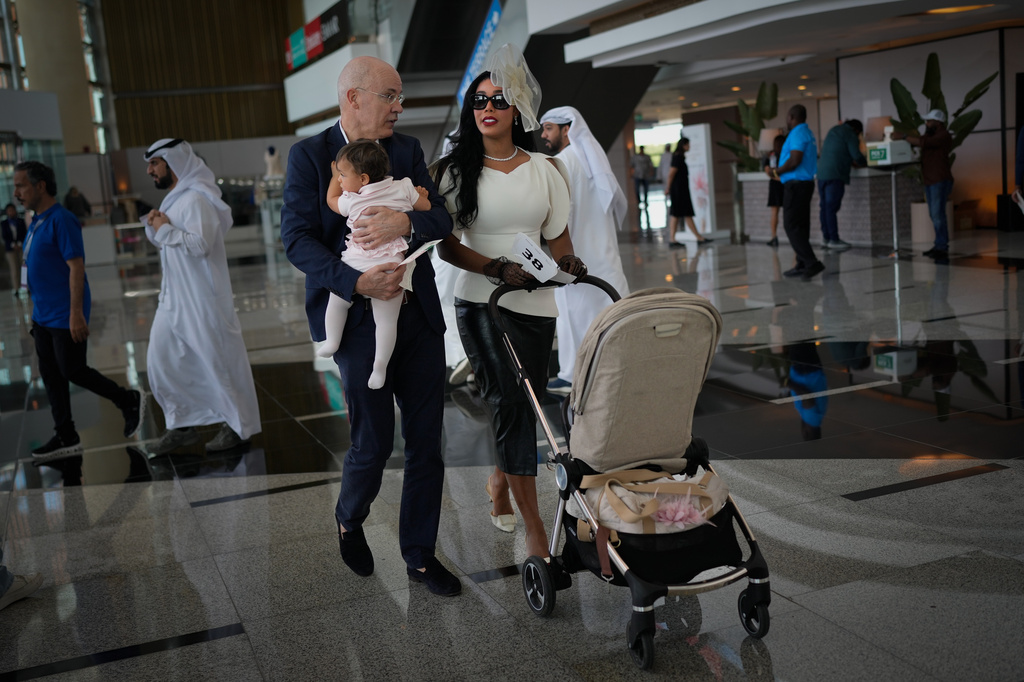 Racegoers arrive at the grandstand ahead of the Dubai World Cup at Meydan Racecourse in Dubai, United Arab Emirates, Saturday, March 28, 2026. (AP Photo/Altaf Qadri)
