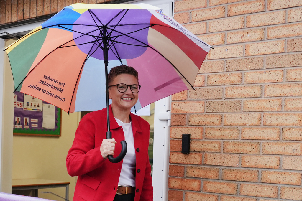 Bev Craig, the Labour Party candidate, departs Broad Oak Primary in Didsbury after voting in the Greater Manchester mayoral by-election, in Manchester, England, Thursday July 30, 2026. (Annabelle Lee-Ellis/PA via AP)