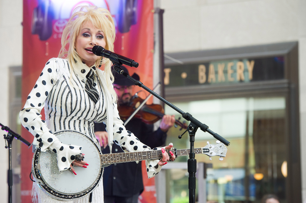 FILE - Dolly Parton performs on NBC's "Today" show in New York on May 13, 2014. (Photo by Charles Sykes/Invision/AP, File)