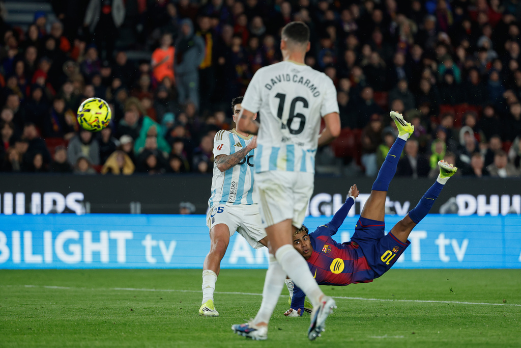 Barcelona's Lamine Yamal scores his side's third goal during a Spanish La Liga soccer match between Barcelona and Real Oviedo in Barcelona, Spain, Sunday, Jan. 25, 2026. (AP Photo/Joan Monfort)