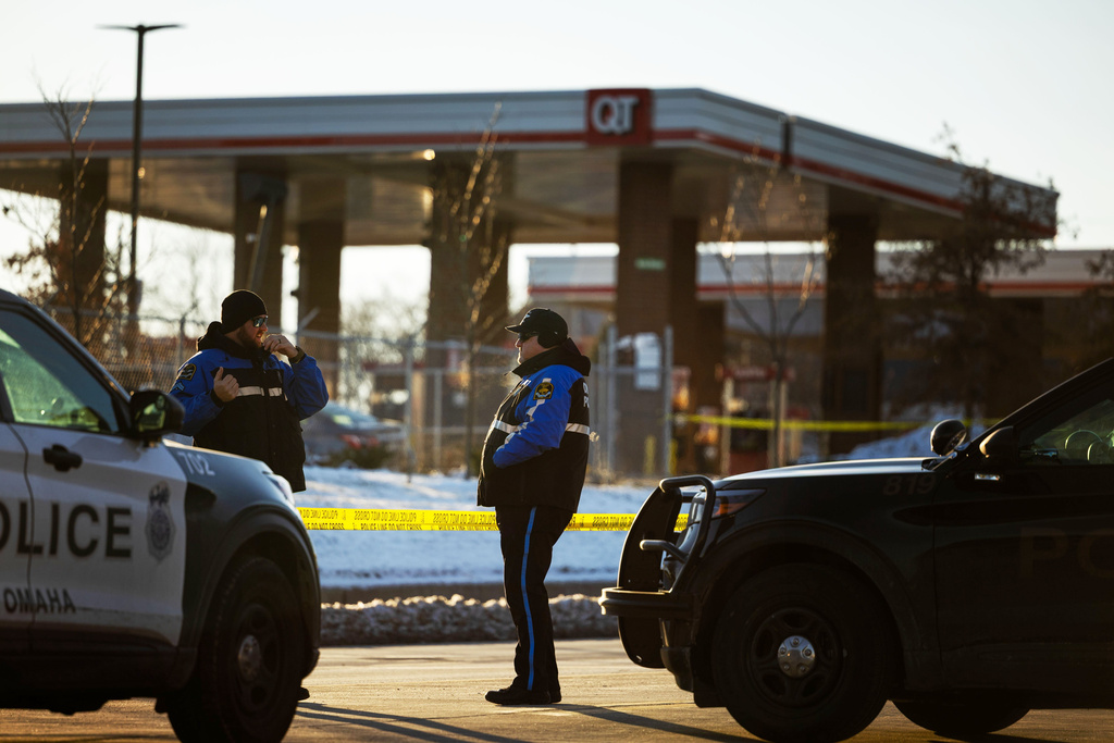 Omaha police investigate an incident at a QuikTrip gas station, that injured three officers and left the suspect dead in Omaha, Neb., Wednesday, Dec. 3, 2025. (Chris Machian/Omaha World-Herald via AP)