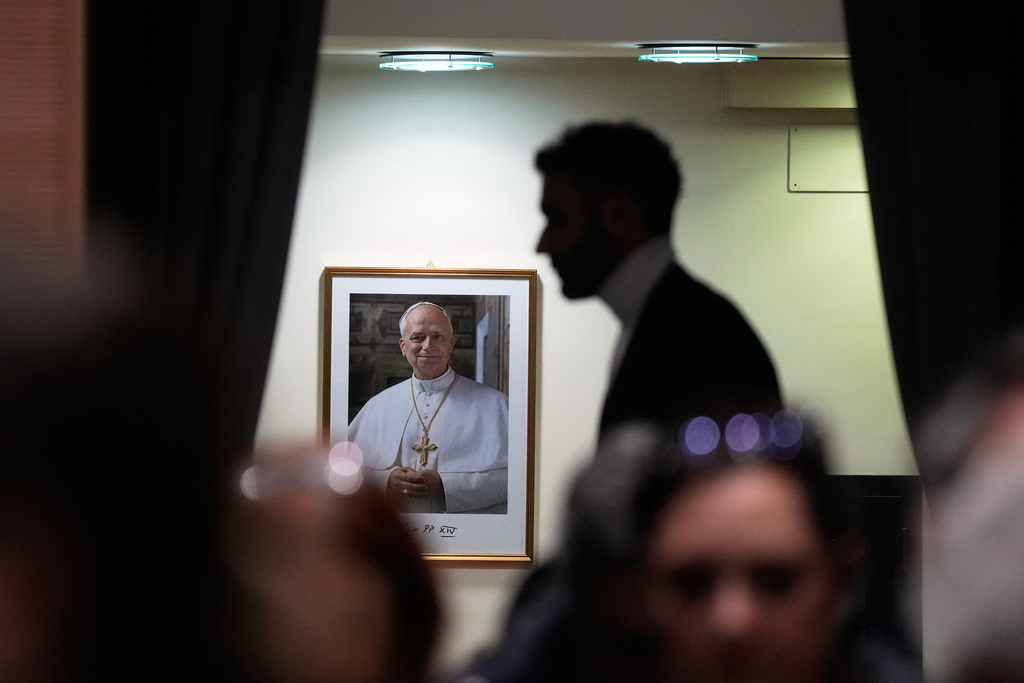 Journalists wait for the start of a press conference at the end of Pope Leo XIV's first Extraordinary Consistory, a special formal assembly convening the College of Cardinals from around the world, at the Vatican, Thursday, Jan. 8, 2026. (AP Photo/Gregorio Borgia)