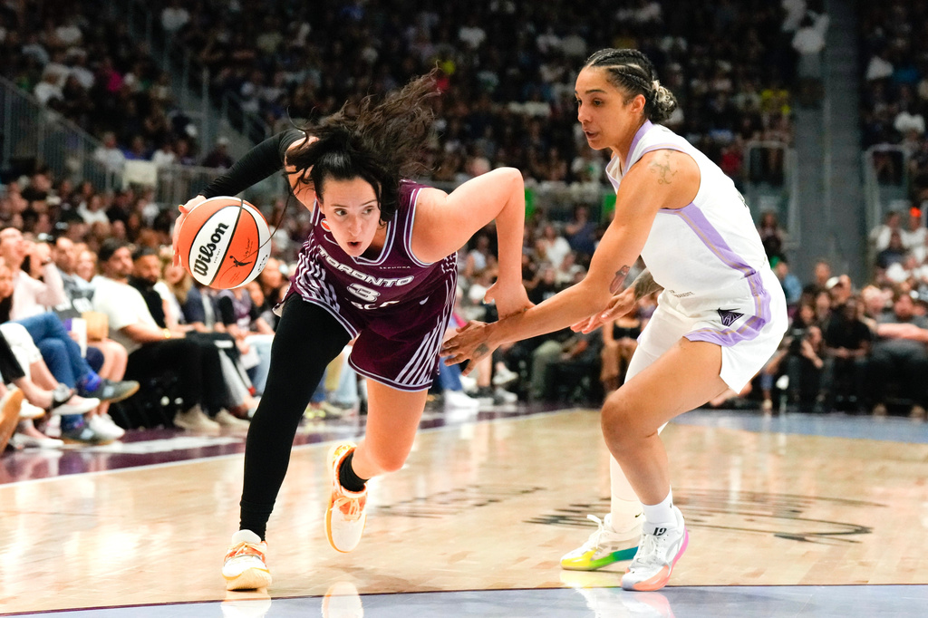 Toronto Tempo Marina Mabrey (3) drives past Golden State Valkyries Gabby Williams (1) during the first half of a WNBA basketball game in Toronto on Wednesday, July 8, 2026. (Chris Young/The Canadian Press via AP)