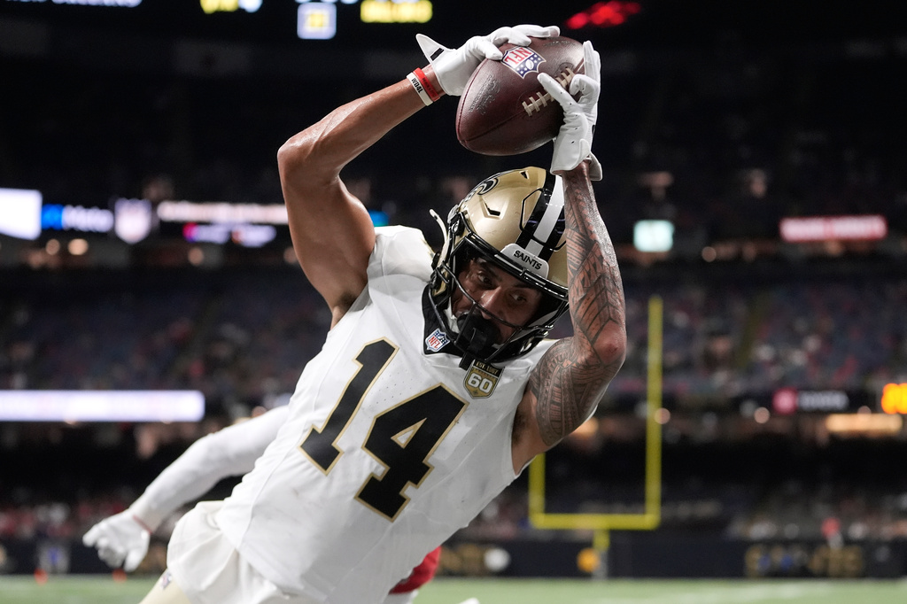 New Orleans Saints wide receiver Devaughn Vele (14) catches a touchdown pass against the Atlanta Falcons during the second half of an NFL football game in New Orleans, Monday, Oct. 5, 2026. (AP Photo/Gerald Herbert)