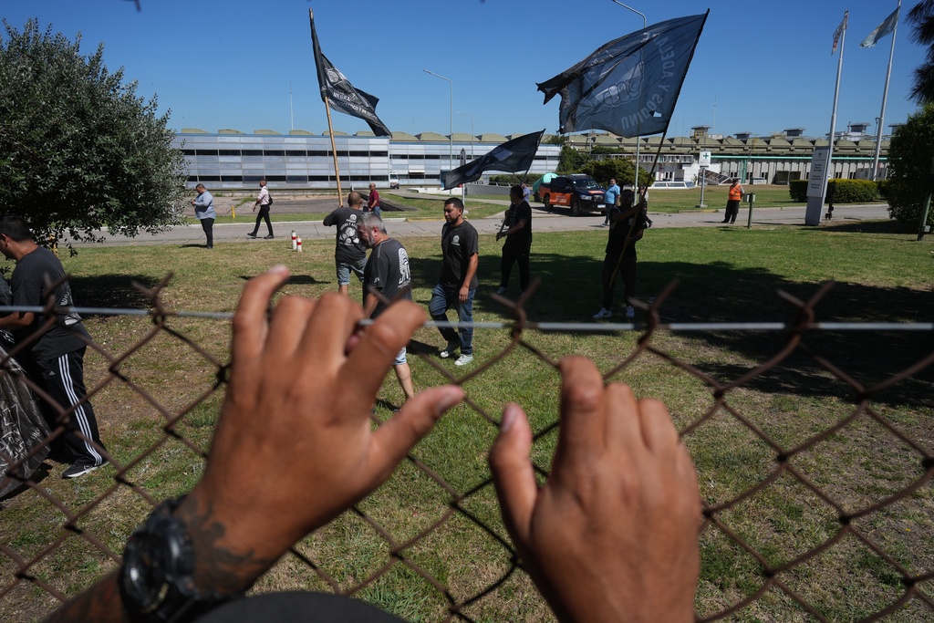 Workers protest after tire maker Fate announced it would shut down operations at its factory in Buenos Aires, Argentina, Wednesday, Feb. 18, 2026. (AP Photo/Rodrigo Abd)